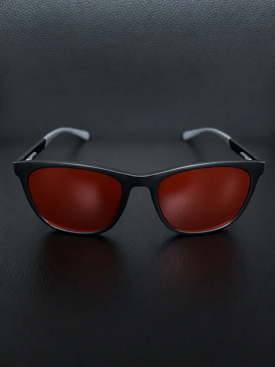 Lumiq blue light blocking glasses — black frame, red lenses, front view