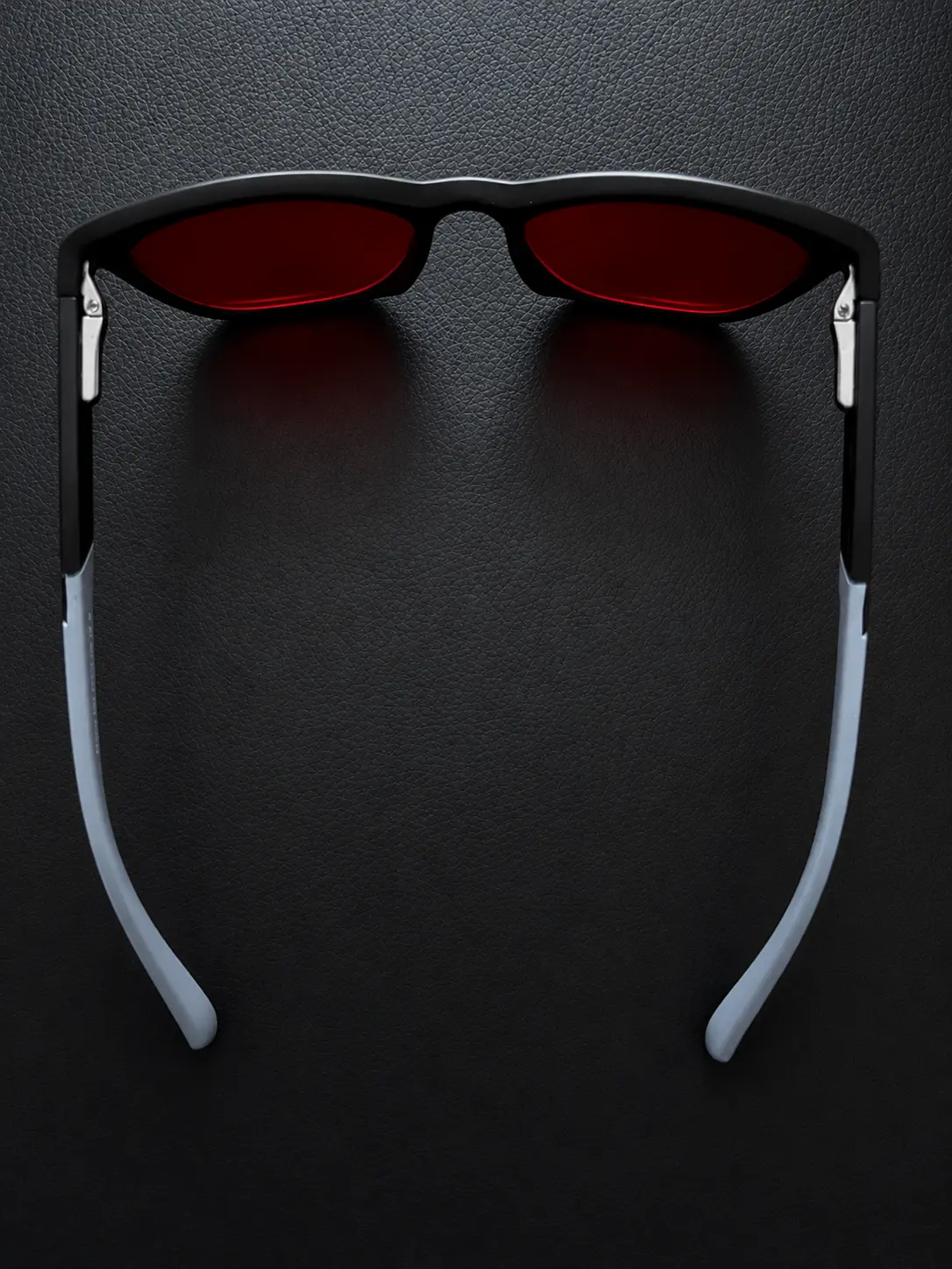 Lumiq blue light blocking glasses top view showing frame and red lenses